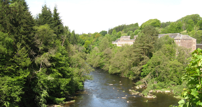 New Lanark with river in foreground, courtesy of James Denham on Flickr Creative Commons