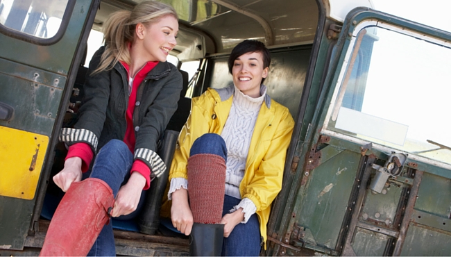 Women sitting in back of landrover