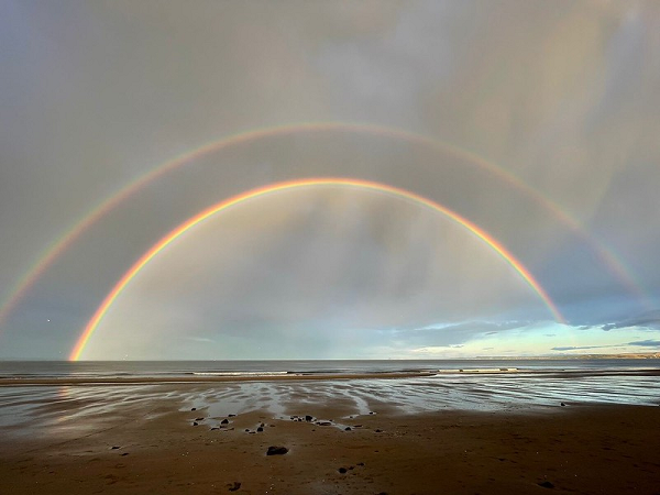 Double rainbow over beach and sea, credit: Alex Clough