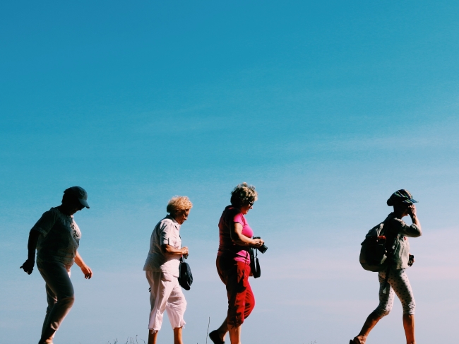 Tourists Walking with blue sky in background