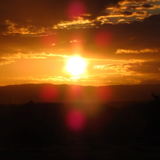 Sunset over Perthshire with camera flare