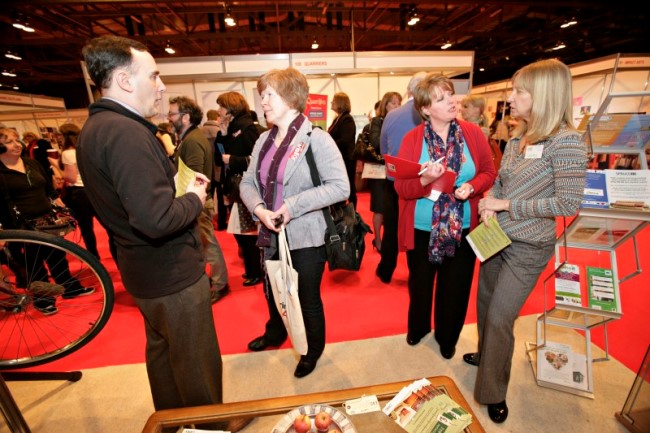 People talking at stand at the Gathering