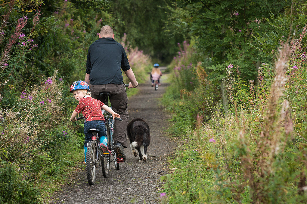 Family cycling in the countryside