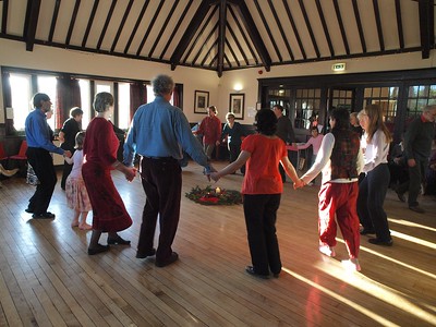 Dancers holding hands in a circle