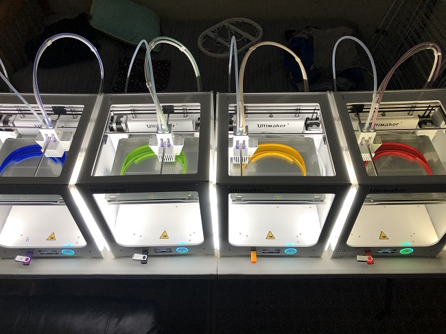 3D printers lined up ready for use