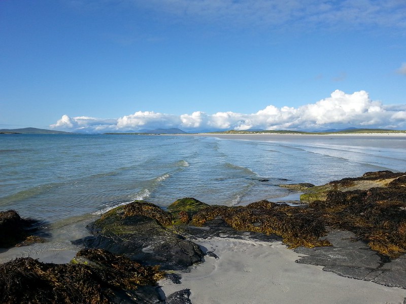 Beach sea view across north Uist. Blue skies and clear waters