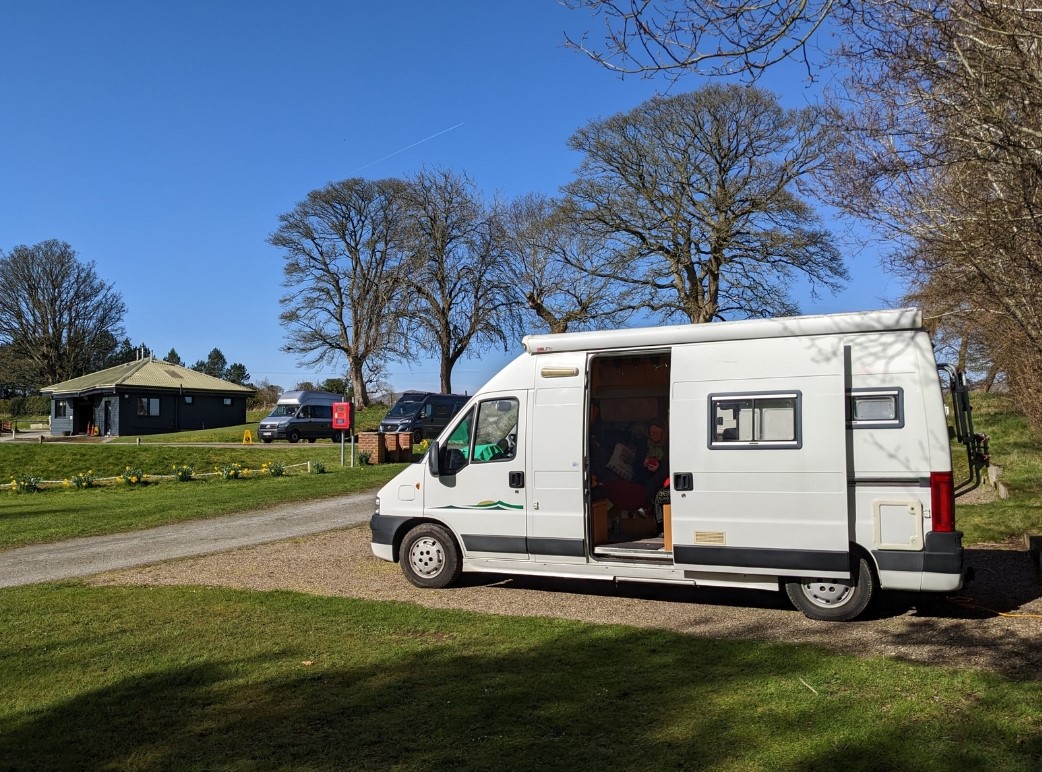 Campervan in Scottish campsite on a sunny day 
