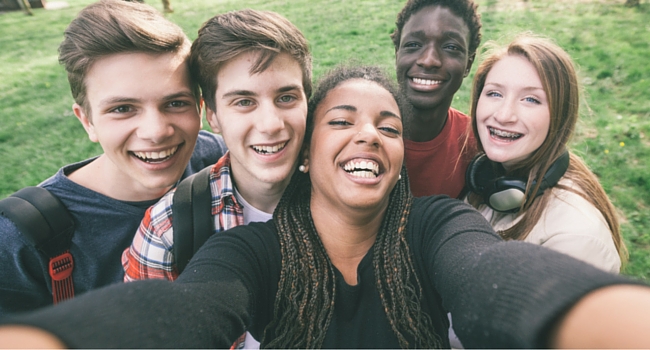 Group of young people smiling at camera