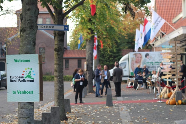 Street scene of Venhorst with European Rural Parliament sign