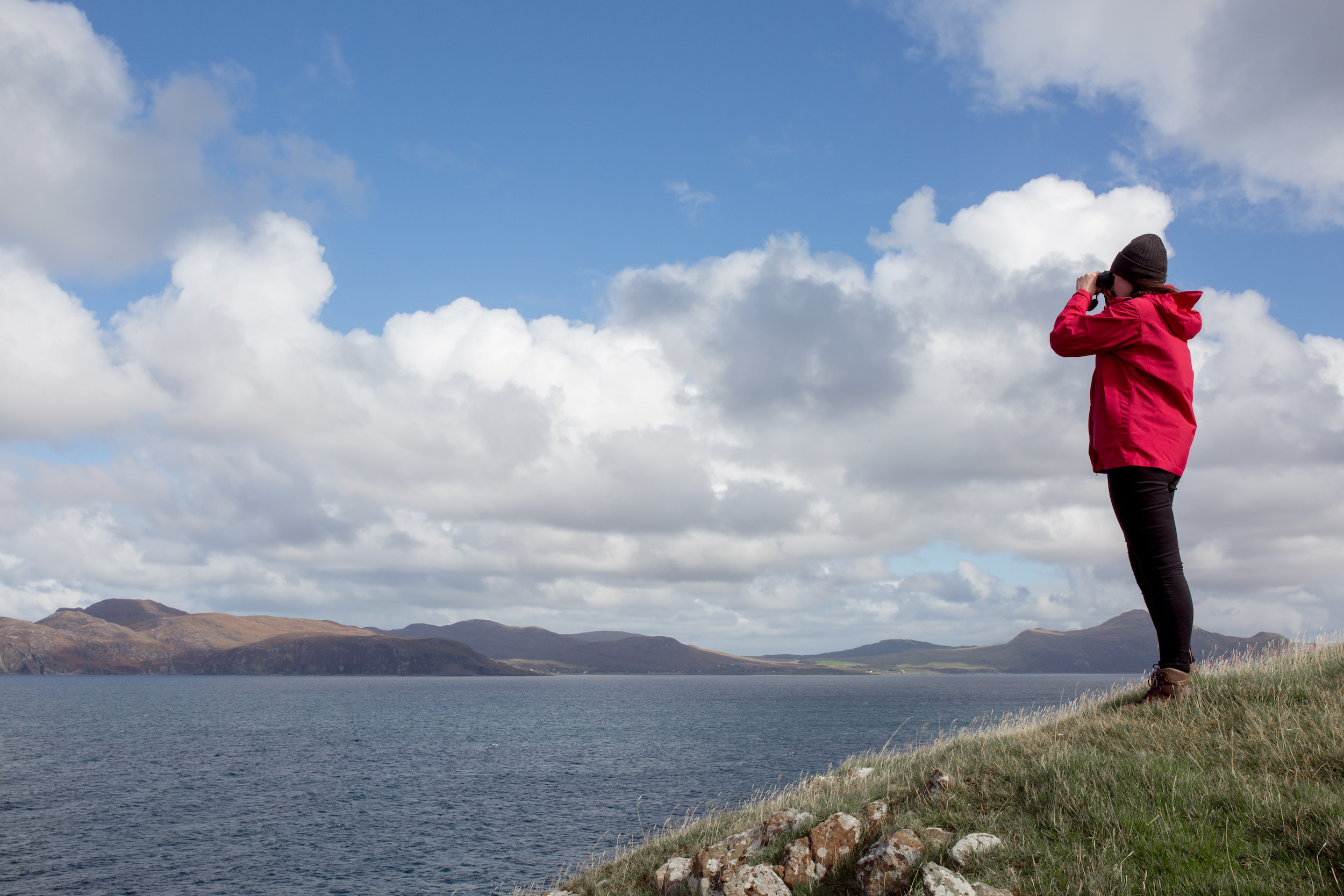 Hebridean Whale and Dolphin Trust Director Alison Lomax looks out for whales © Lucy Hunter