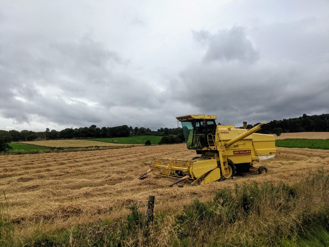 Combine harvester in field, Aberdeenshire