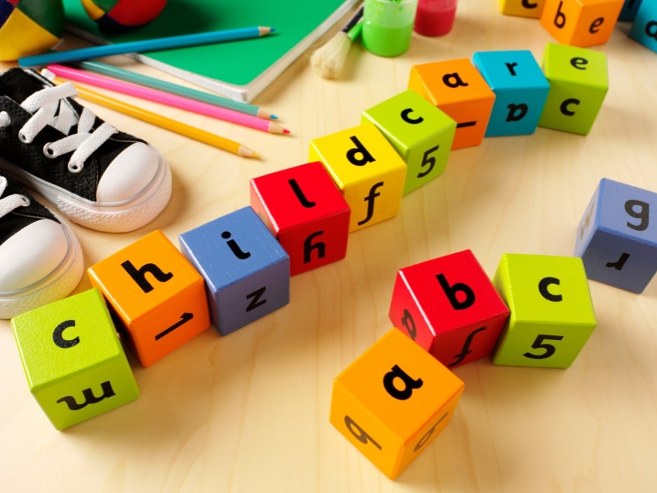 Wooden coloured blocks spelling childcare and ABC