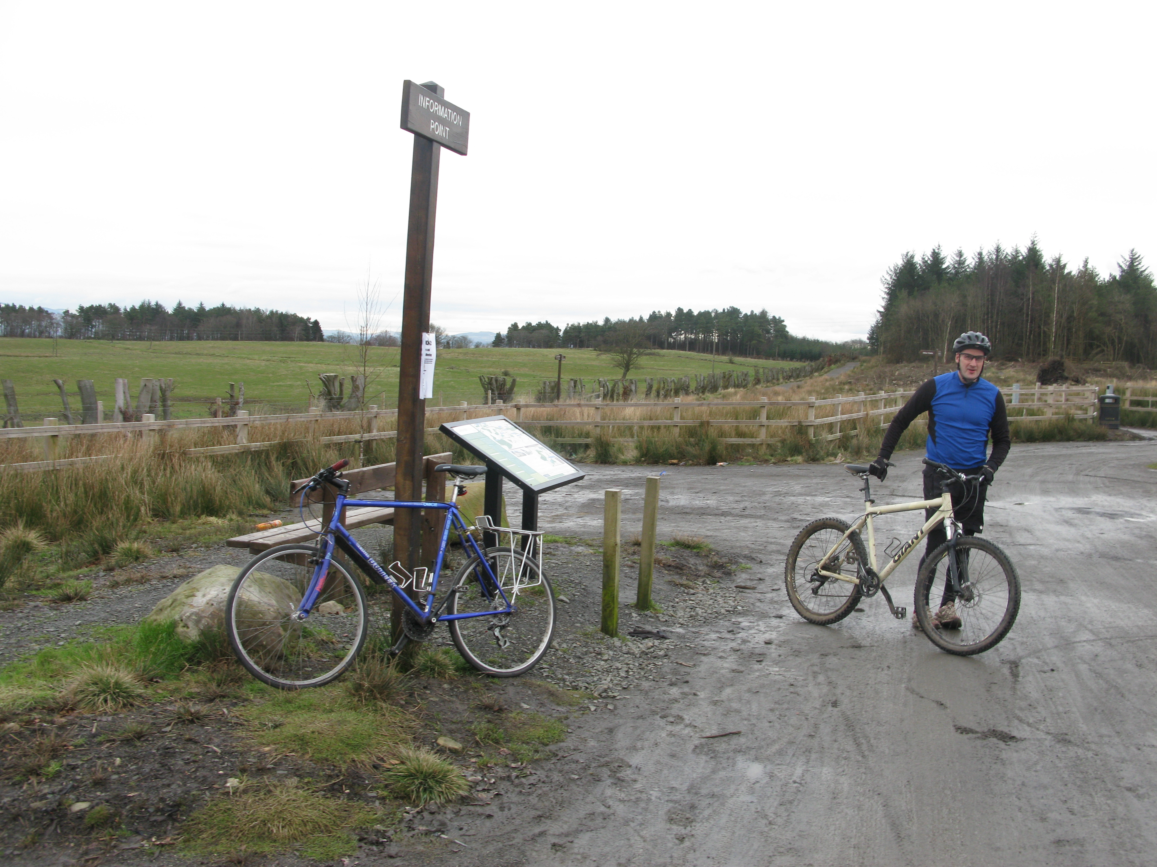 Man on bike on cycle path with signs