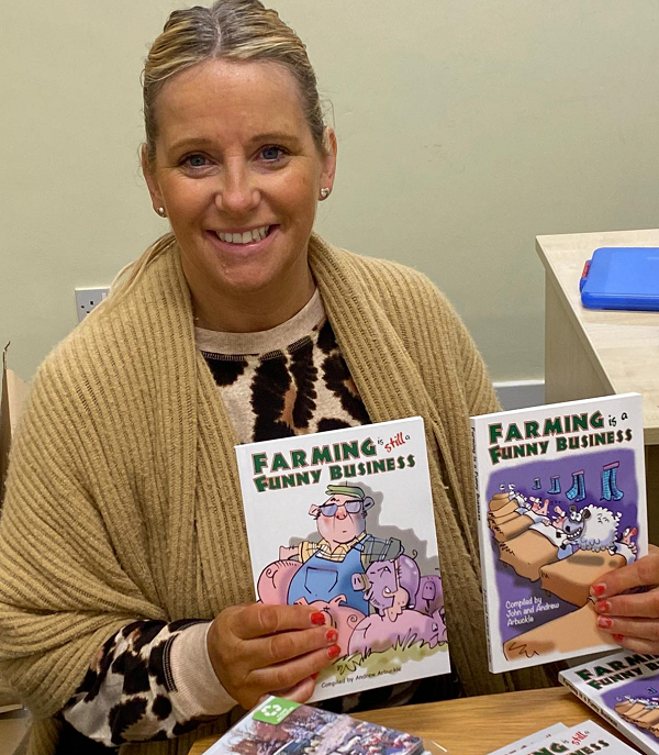 RSABI Office and Volunteer Manager Lorraine Caven holding copies of “Farming is Still a Funny Business” and its predecessor “Farming is a Funny Business”. 