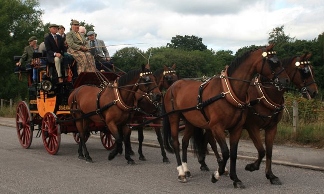 horse drawn coach with passengers
