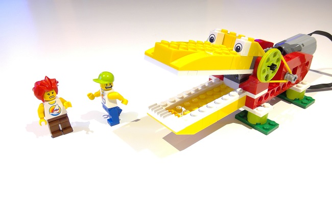 Lego model crocodile and two lego people