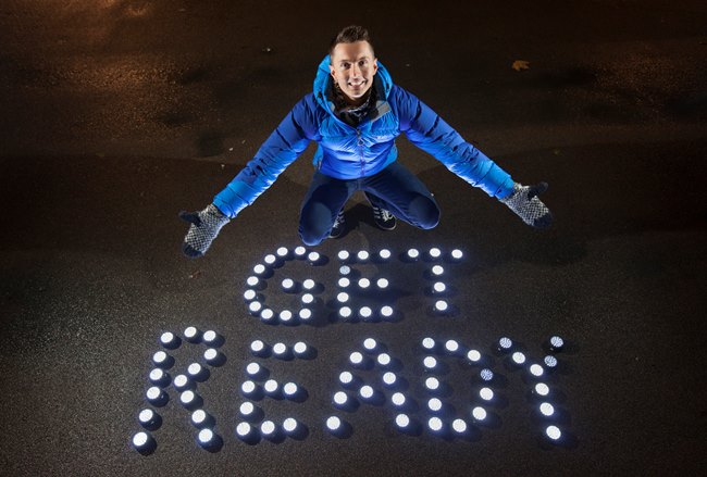 Sean Batty with 'Get Ready' written on ground with torches