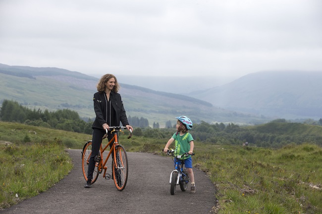 Woman and child on bikes on path