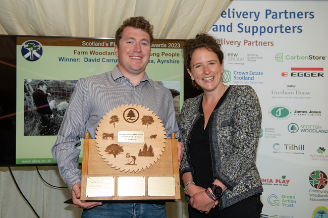 Rural Affairs Secretary Mairi Gougeon presents the Scottish Woodlands Ltd. Trophy for Young People to David Carruth of Brodoclea by Julie Broadfoot