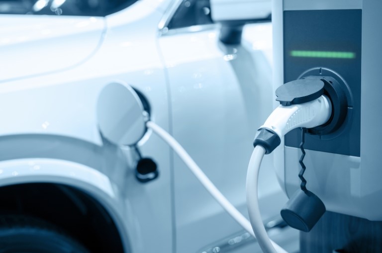Charging an electric car battery, new innovative technology EV Electrical vehicle being charged - pic by Totojang via Canva