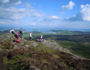 Teenagers at the summit of a hill