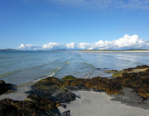 Beach sea view across north Uist. Blue skies and clear waters