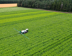 Arial shot of Spraying potato fields in Moray