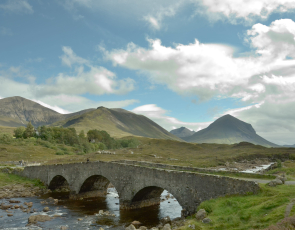 View of Sligachan Bridge, Skye with distant mountains in the background