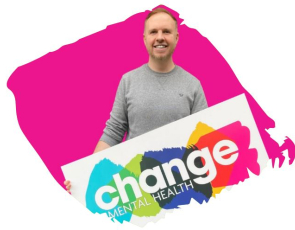 Man holding Change Mental Health logo banner with pink background