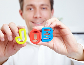Man holding letters spelling out the word job