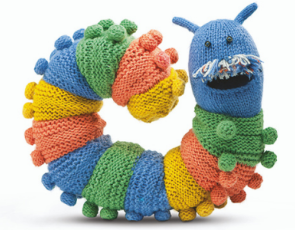 Knitted multicoloured caterpillar draft excluder smiling