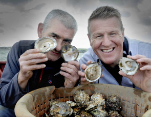 Pictured aboard the “Vital Spark”, a Stranraer based fishing vessel gathering the first oyster haul of the season are Allan Jenkins (left, project manager for Stranraer Development Trust, the community organisation that runs the oyster festival) and Vital Spark captain and oyster fisherman Rab Lamont. 