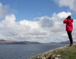 Hebridean Whale and Dolphin Trust Director Alison Lomax looks out for whales © Lucy Hunter