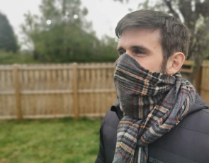 man wearing scarf over face