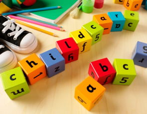 Wooden coloured blocks spelling childcare and ABC