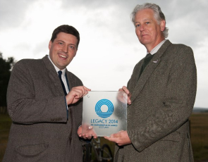 Jamie Hepburn, Minister for Sport, Health Improvement and Mental Health and CNPA Convener, Peter Argyle holding Legacy 2014 award