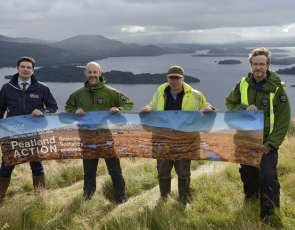 People holding Peatland Action banner