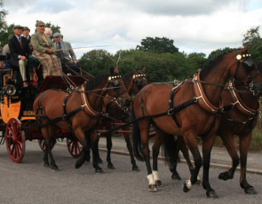 horse drawn coach with passengers