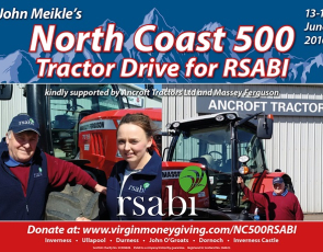 Man and woman next to tractor advertising North Coast 500 Tractor Ride