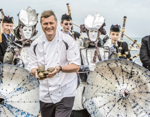 Chef with oysters and pipe band