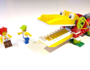 Lego model crocodile and two lego people