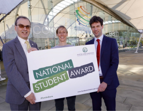 Scottish Land Commission representatives holding National Student Award sign