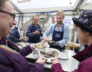 Shucking Champion Alexander Wallace serves oysters