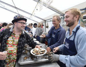 Oyster Bar at 2022 Stranraer Oyster Festival - customer receiving plate of oysters from festival staff