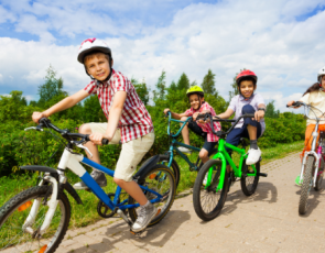Children riding bikes on cycle path