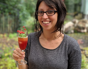Rox Madeira of Trossachs Wild Apothecary holding a cocktail