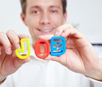 Man holding letters spelling out the word job
