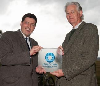 Jamie Hepburn, Minister for Sport, Health Improvement and Mental Health and CNPA Convener, Peter Argyle holding Legacy 2014 award