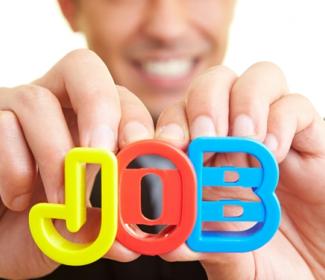 close up of person holding letter up spelling 'job'