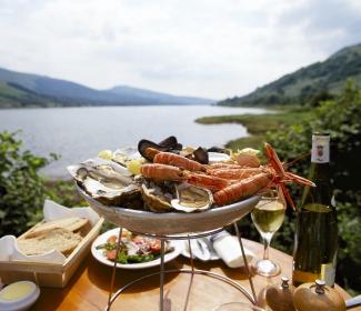 seafood platter sitting on table overlooking loch